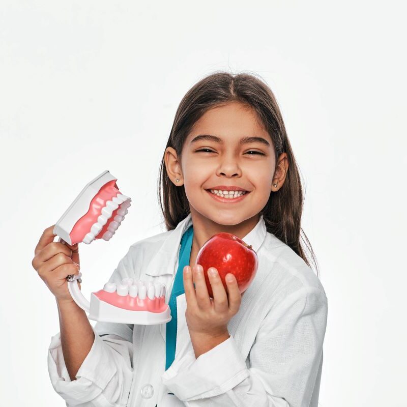 Little Girl Learning About Healthy Foods & Dental Care in San Francisco, California