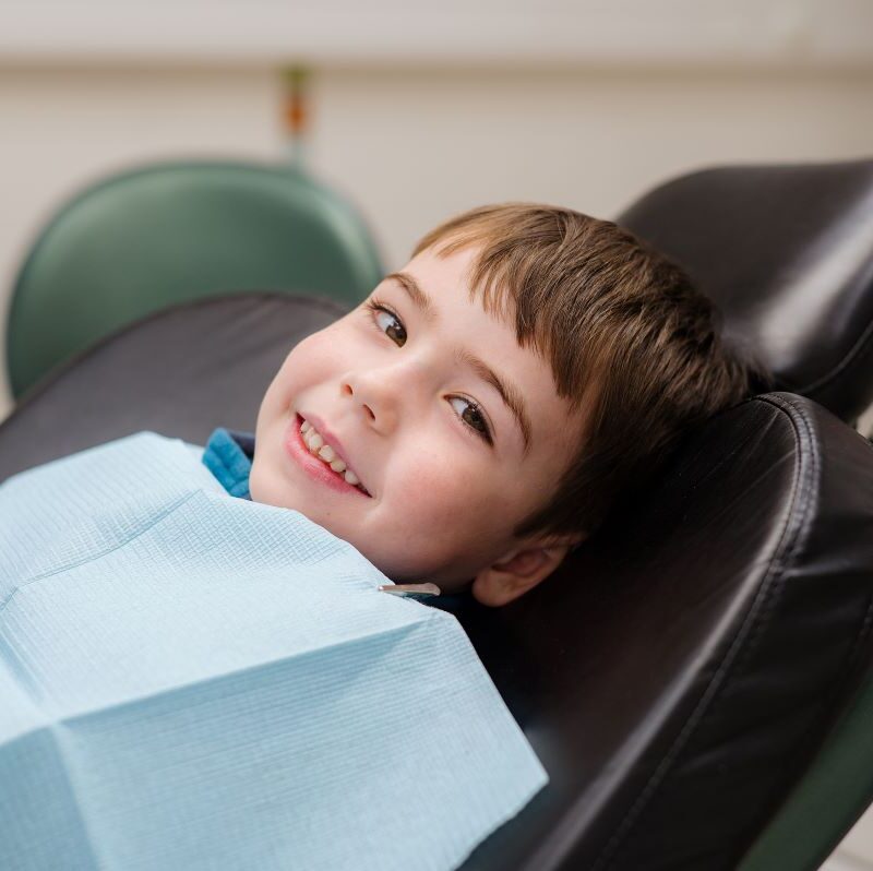 Boy smiling at emergency appointment in San Francisco, California