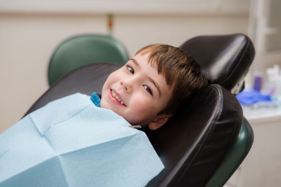 Boy smiling at emergency appointment in San Francisco, California